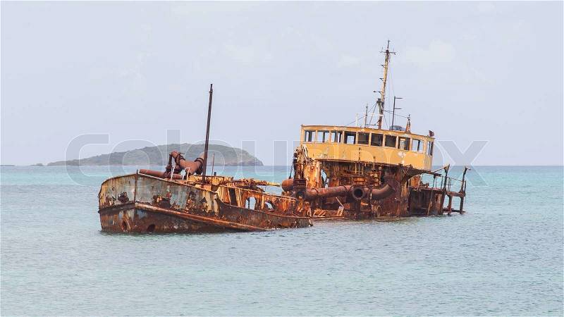 Unidentified sunken vessel at the coast of the Caribbean Isle of Saint Martin, stock photo