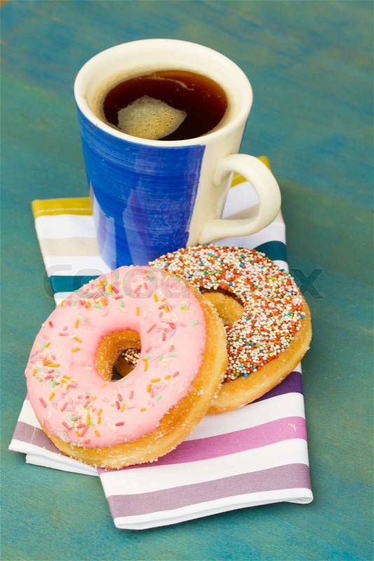 Breakfast with fresh black coffee and donuts, stock photo