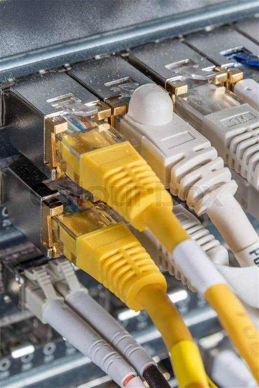 Network hub and patch cables, stock photo