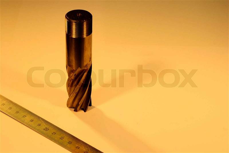 Milling and measuring tool on isolated dark background, stock photo
