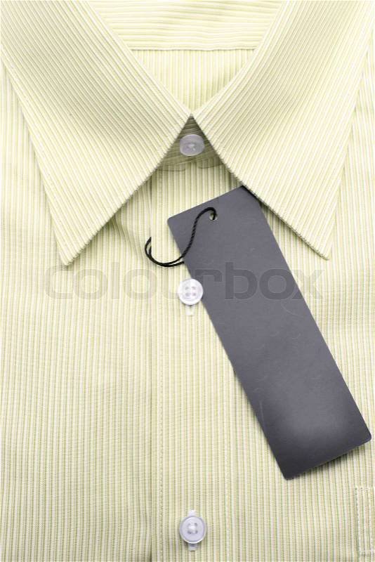 Close up view of a generic line pattern yellow business shirt with a blank label, stock photo