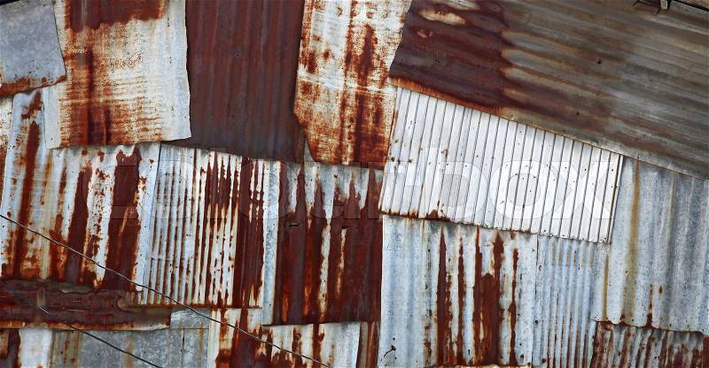Abstract old rusty galvanized and corrugated steel panel, stock photo