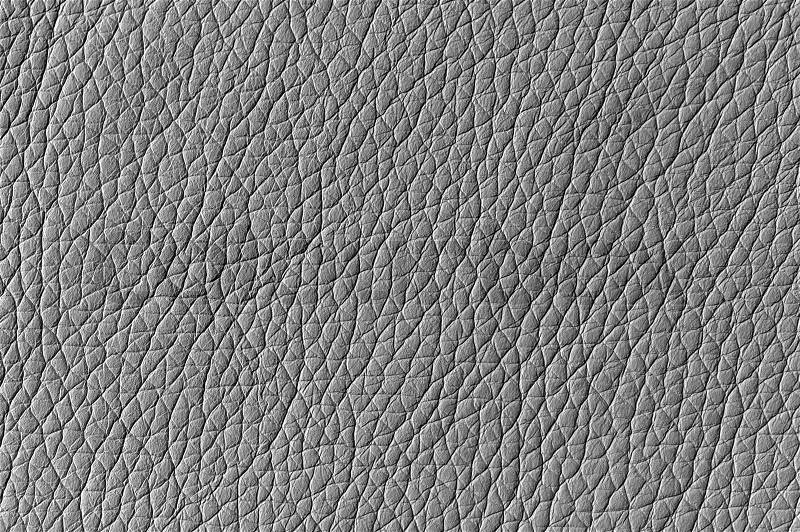 A close-up shot of silver glossy artificial leather background texture, stock photo