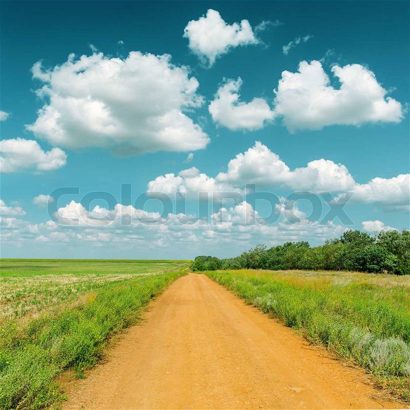 Red colors road to cloudy horizon, stock photo