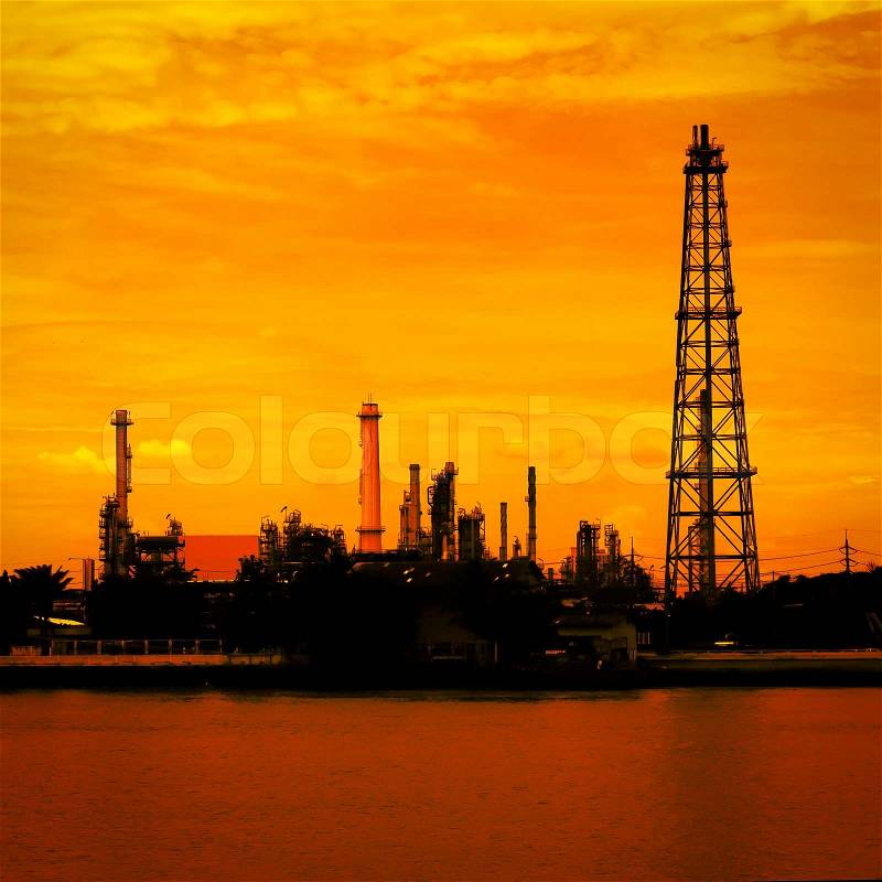 Petroleum oil refinery factory near riverside in Thailand, warm tone, stock photo