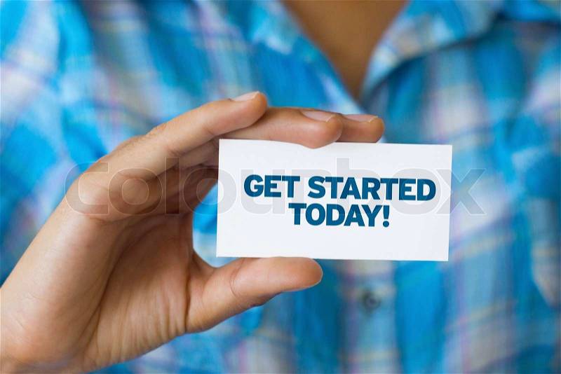 A person holding a white card with the words Get Started Today, stock photo