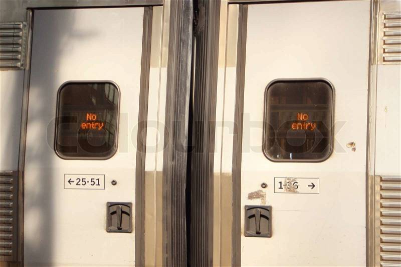 Closed sliding train doors with No Entry sign, stock photo