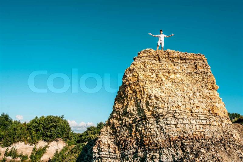 Male person on the top of the world, stock photo