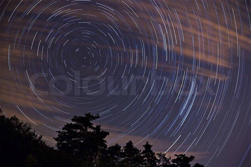 Star trails with Polaris in the center, stock photo