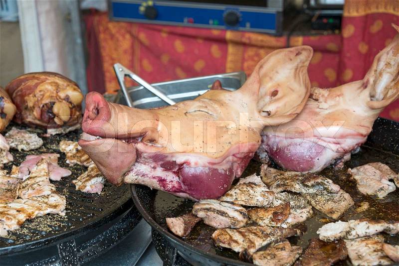 Pigs head with ears and nose as food on the market, stock photo