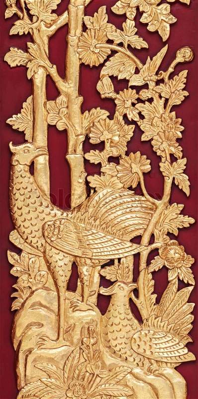 Mythical Thai Style Carving on red Wooden Wall, General Thai Temple Art, stock photo