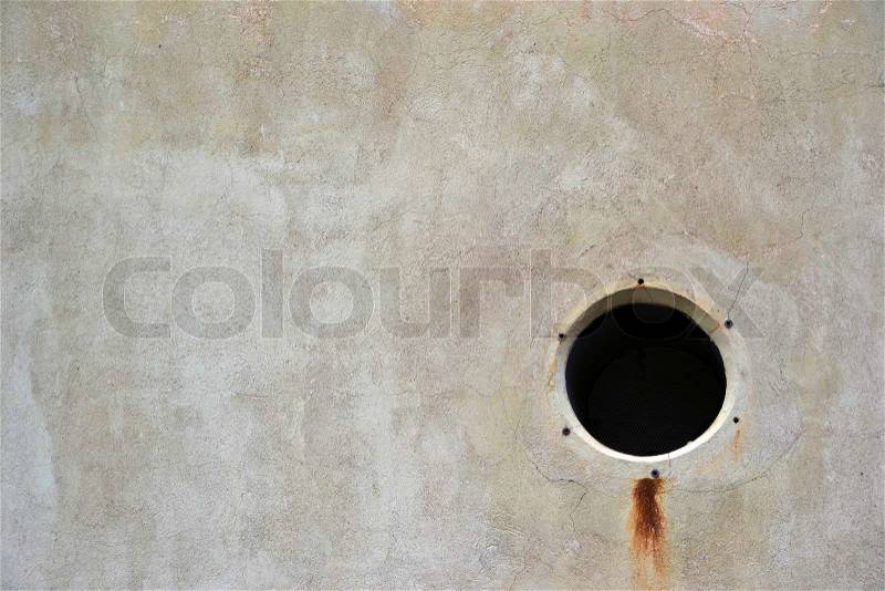 A vent hole in the wall of an industrial building, stock photo