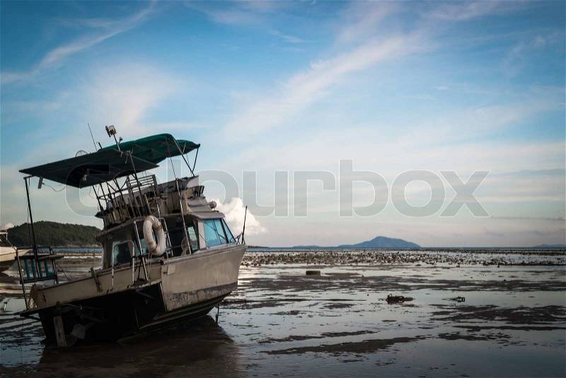 Motor boat with low tide, stock photo