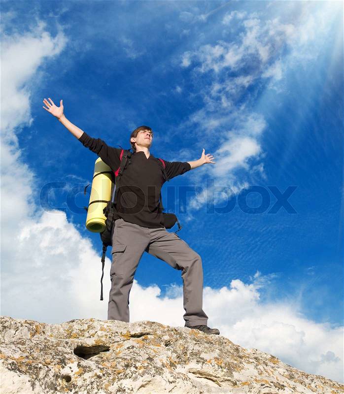 Man on top of mountain. Conceptual design, stock photo