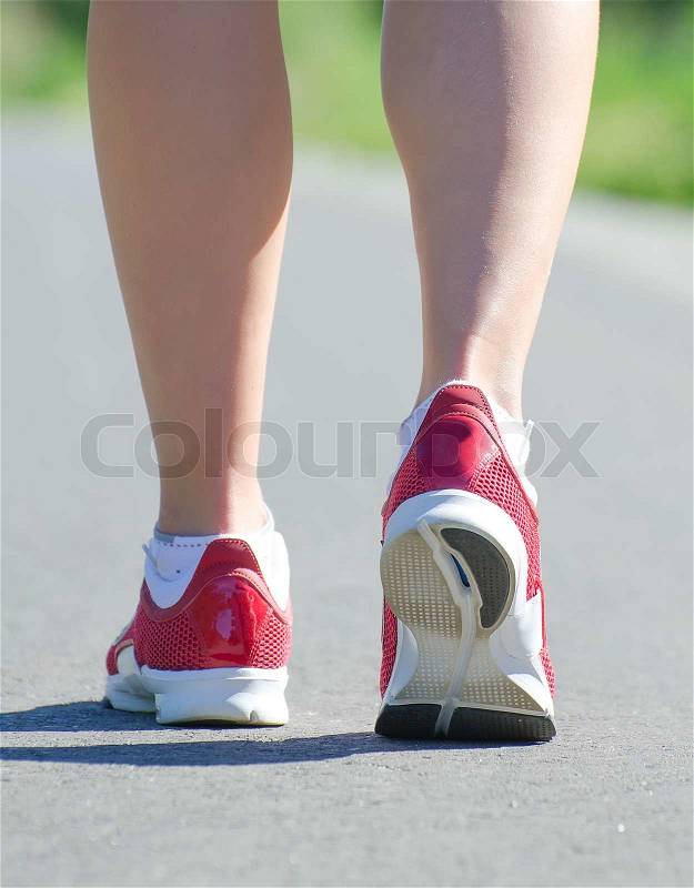 Female legs during outdoor workout, stock photo