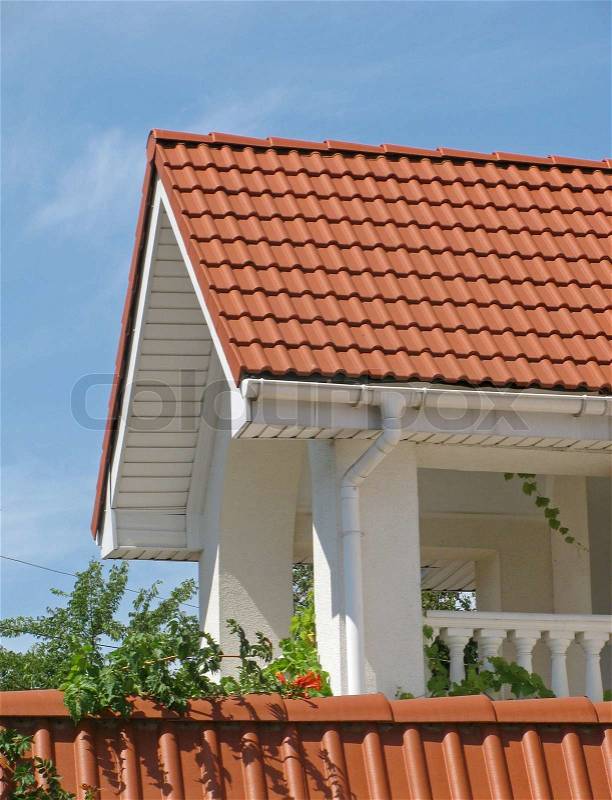 Balcony of cottage with red tiled roof, stock photo