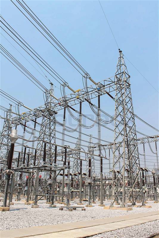 High power of electricity in Electricity transmission yard with blue sky, stock photo