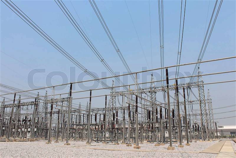 High power of electricity in Electricity transmission yard with blue sky, stock photo