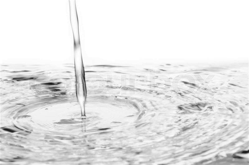 Pouring water to mirror isolated on white, stock photo