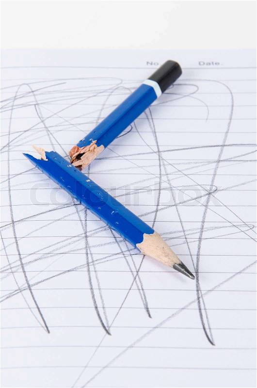 Broke pencil on notebook, stock photo