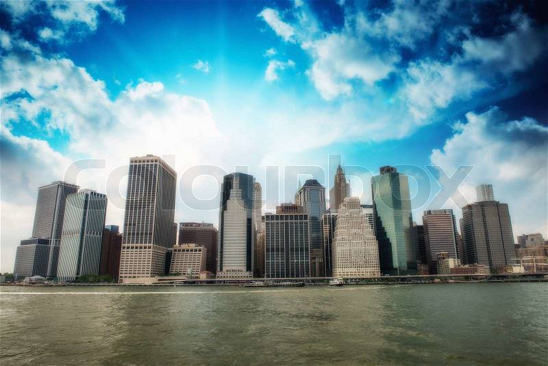 Buildings of Lower Manhattan as seen from East River - New York City, stock photo
