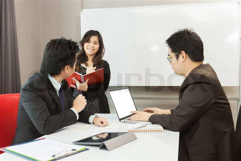 Young business people are working in the meeting room with blank notebook screen, stock photo
