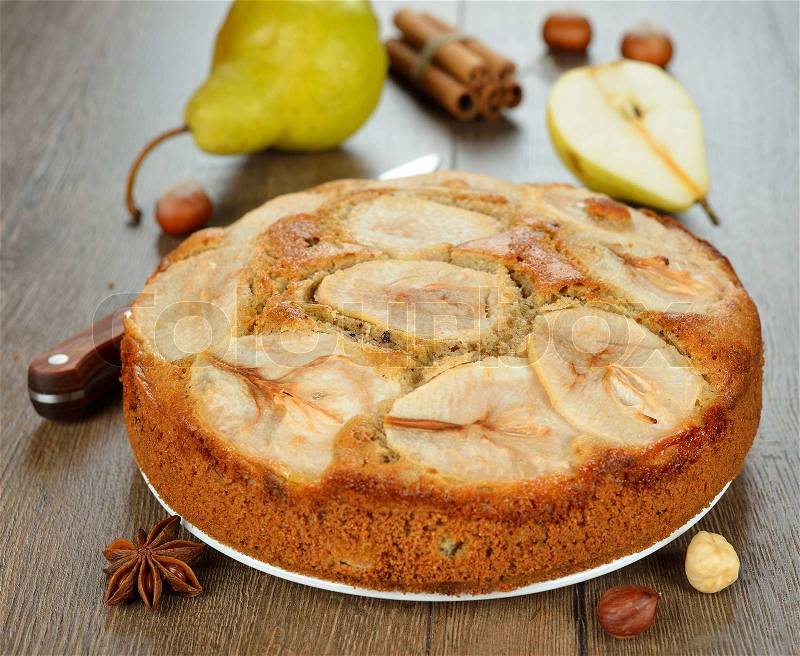 Pear pie on a brown background, stock photo