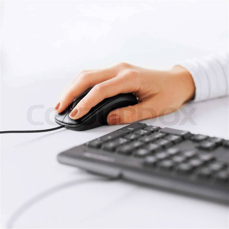 Business, office, school and education concept - woman hands with keyboard and mouse, stock photo