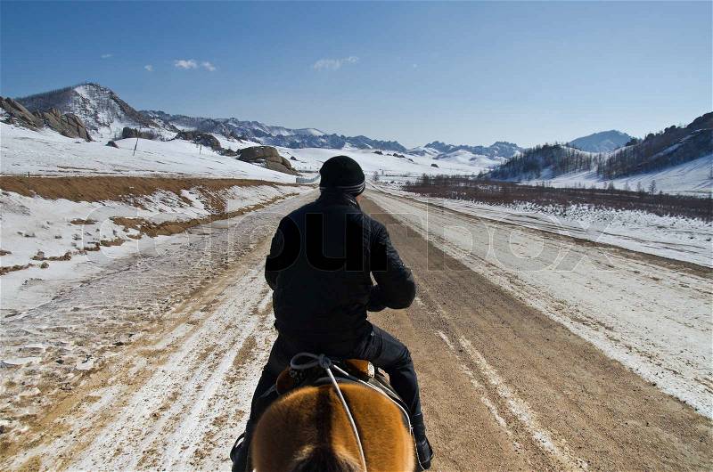 Horserider in mongolian wilderness, stock photo