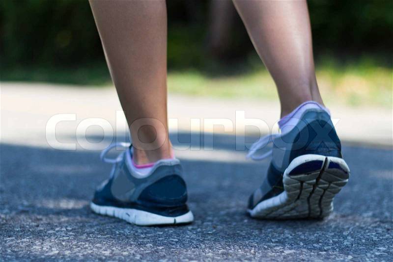 Running shoes close-up of a fit woman, stock photo