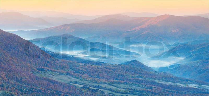 Panorama of the autumn mountains. Foggy mogning, stock photo