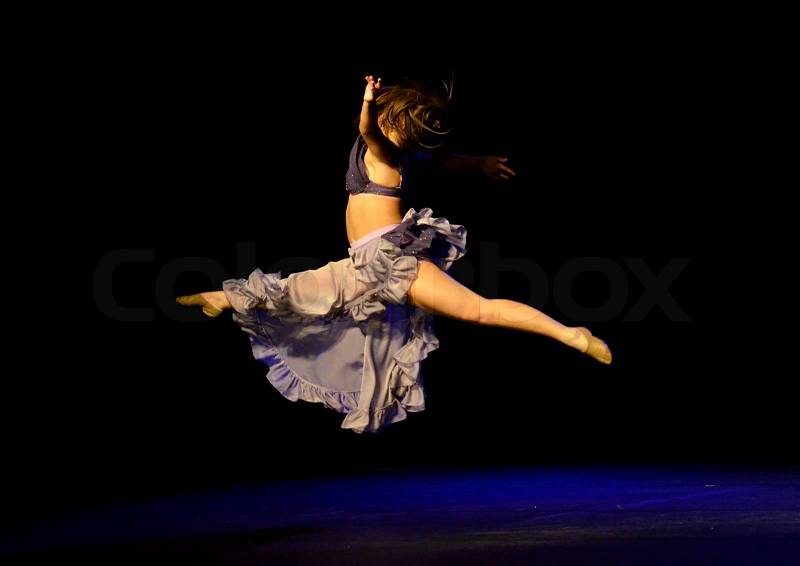 Dance is a type of art that generally involves movement of the body, often rhythmic and to music. And of course need the sixth sense. This picture was taken in Dance competition in Toronto, stock photo