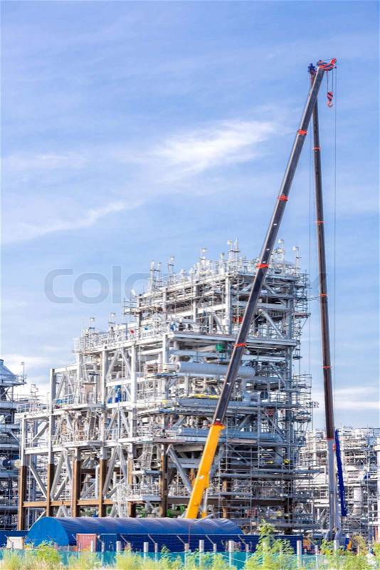 Assembling of liquefied natural gas Refinery Factory with LNG storage tank using for Oil and gas industry background, stock photo