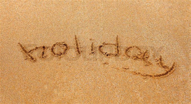 Holiday inscription on the sand, stock photo