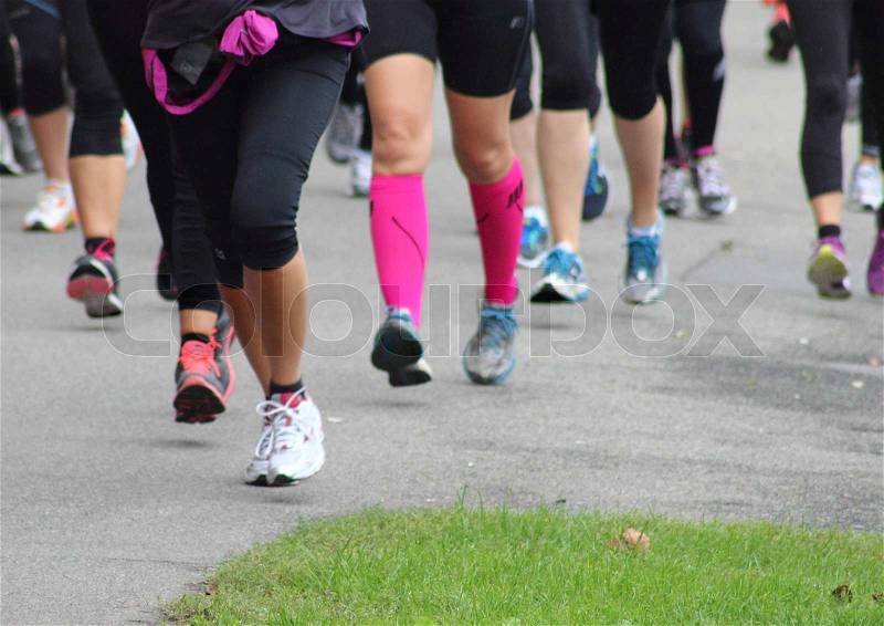 Running line of legs from a race, stock photo