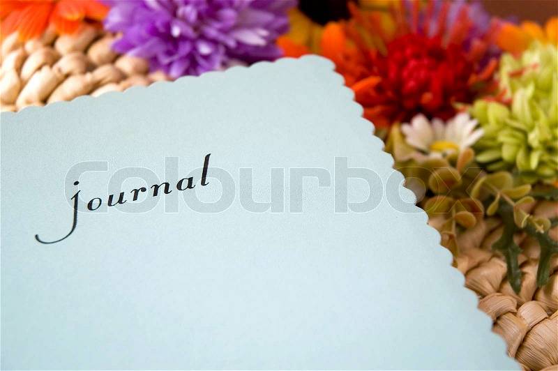 Journal with colorful flowers background, stock photo