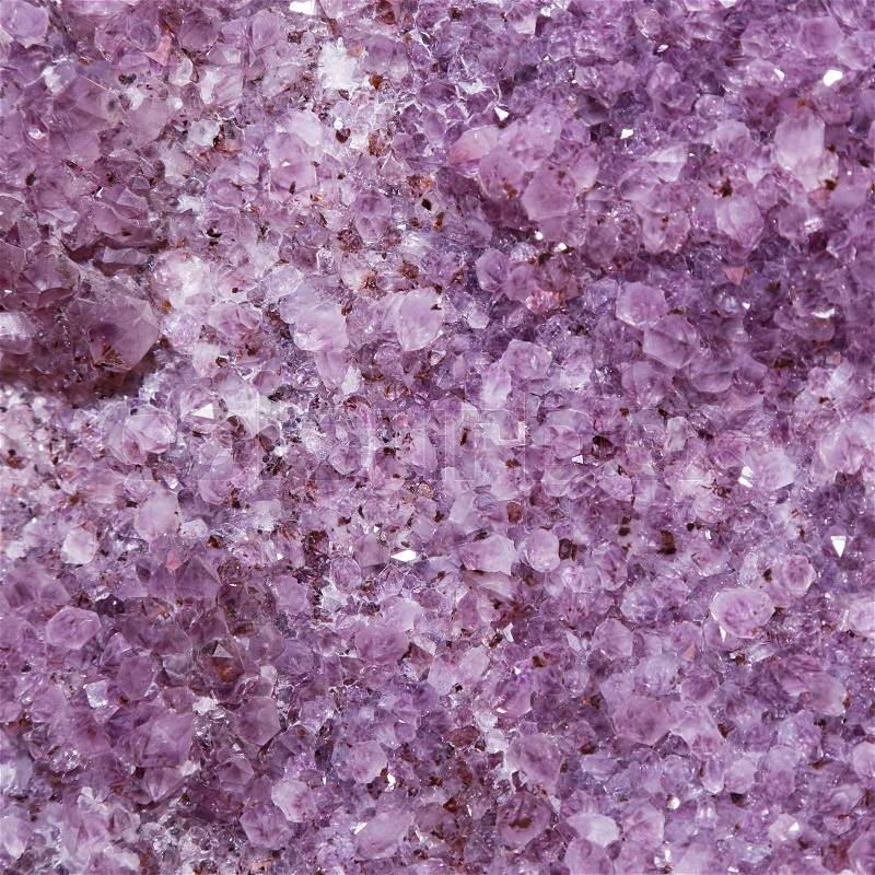 Background of natural amethyst a violet gem stone, stock photo