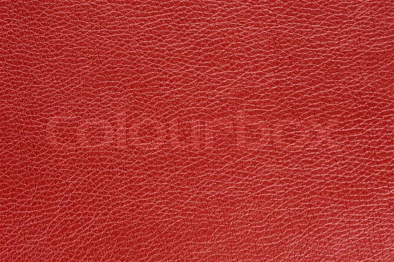 A macro shot of red glossy patterned artificial leather background texture, stock photo