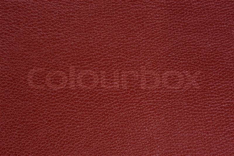 A macro shot of claret glossy patterned artificial leather background texture, stock photo