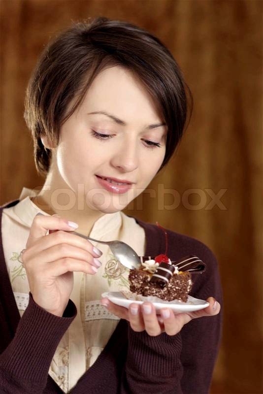 Happy woman and cake, stock photo