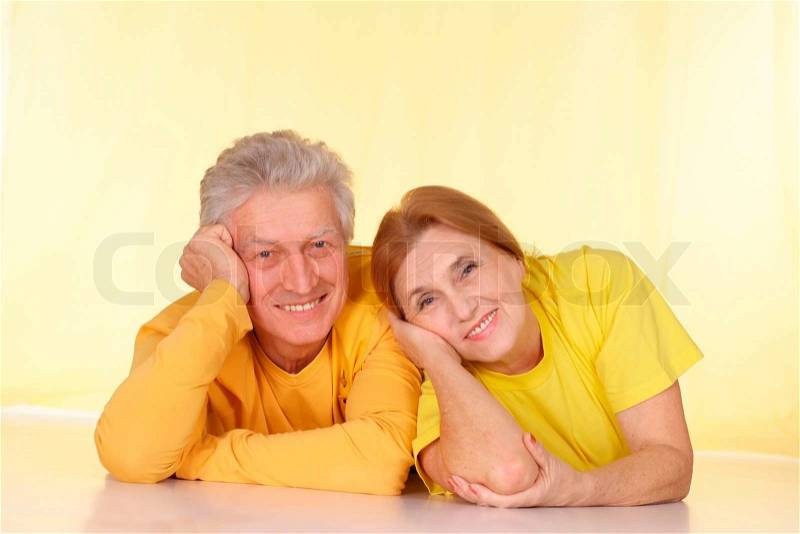 Fine family in yellow t-shirts having a good time together, stock photo