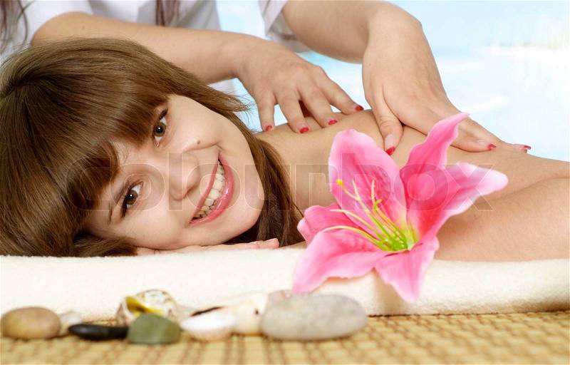 Nice girl with a bright appearance rests in the spa, stock photo