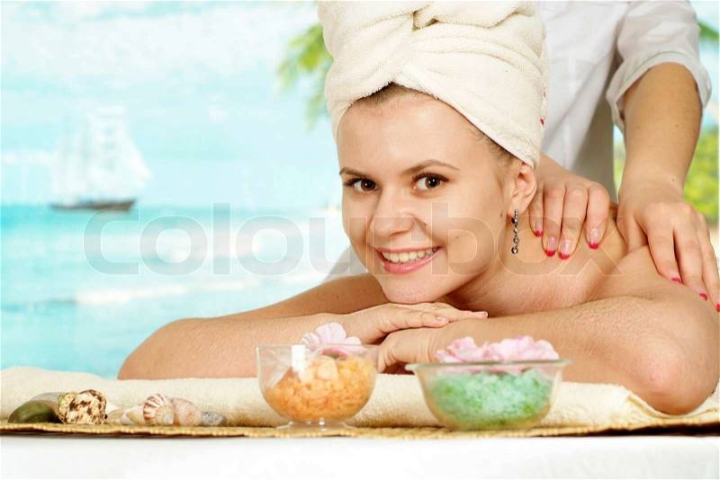 Happy girl with a bright appearance rests in the spa, stock photo