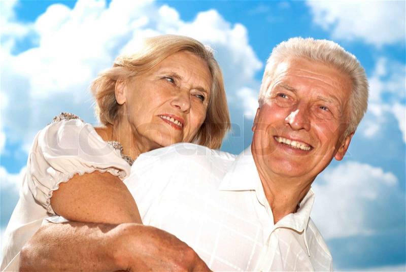 Happy elderly couple went for a walk on the nature, stock photo