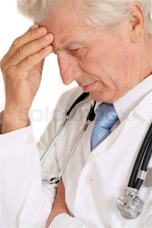 Pensive doc in a white coat with a stethoscope, stock photo