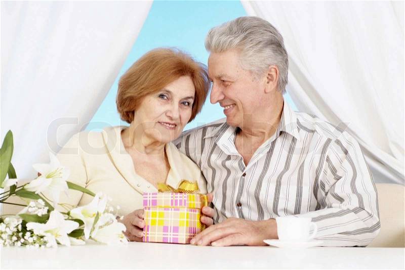 Nice older couple together in the room, stock photo