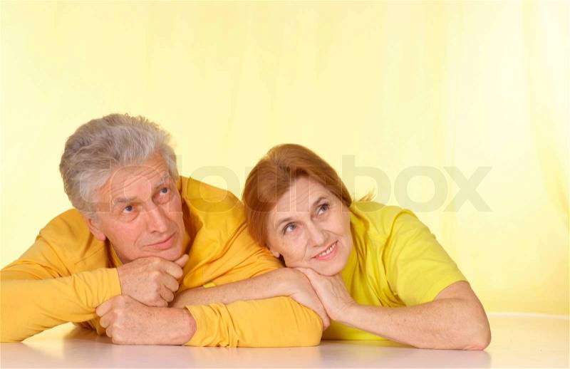 Fine family in yellow t-shirts having a good time together, stock photo