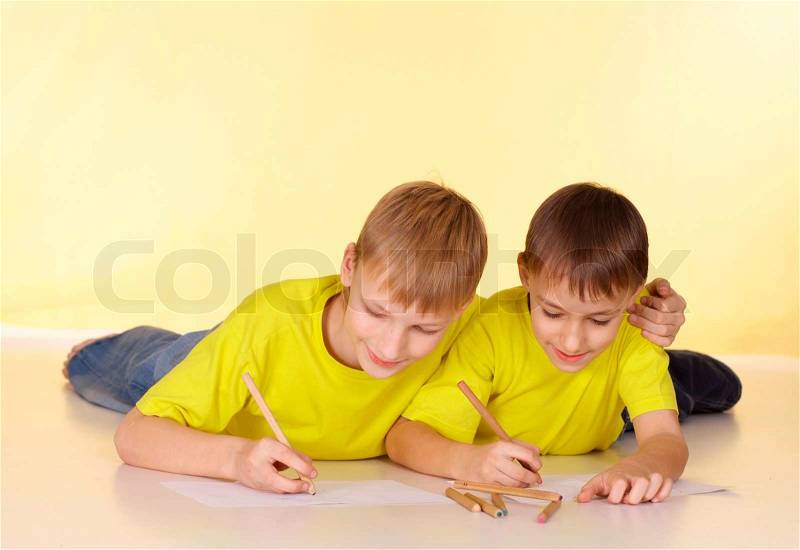 Positive family in yellow t-shirts having a good time together, stock photo