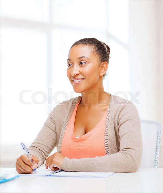 Education and business concept - international student studying in college, stock photo