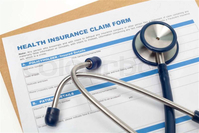 Medical reimbursement with health insurance claim form and stethoscope, stock photo